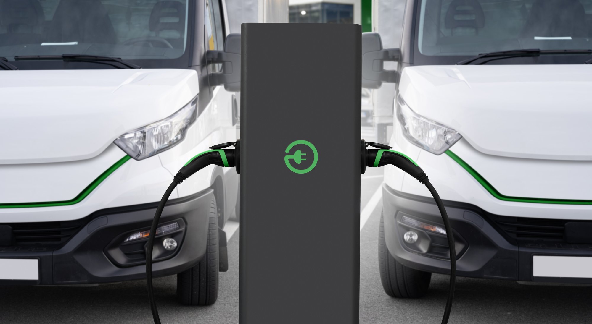 row of electric vehicles charging