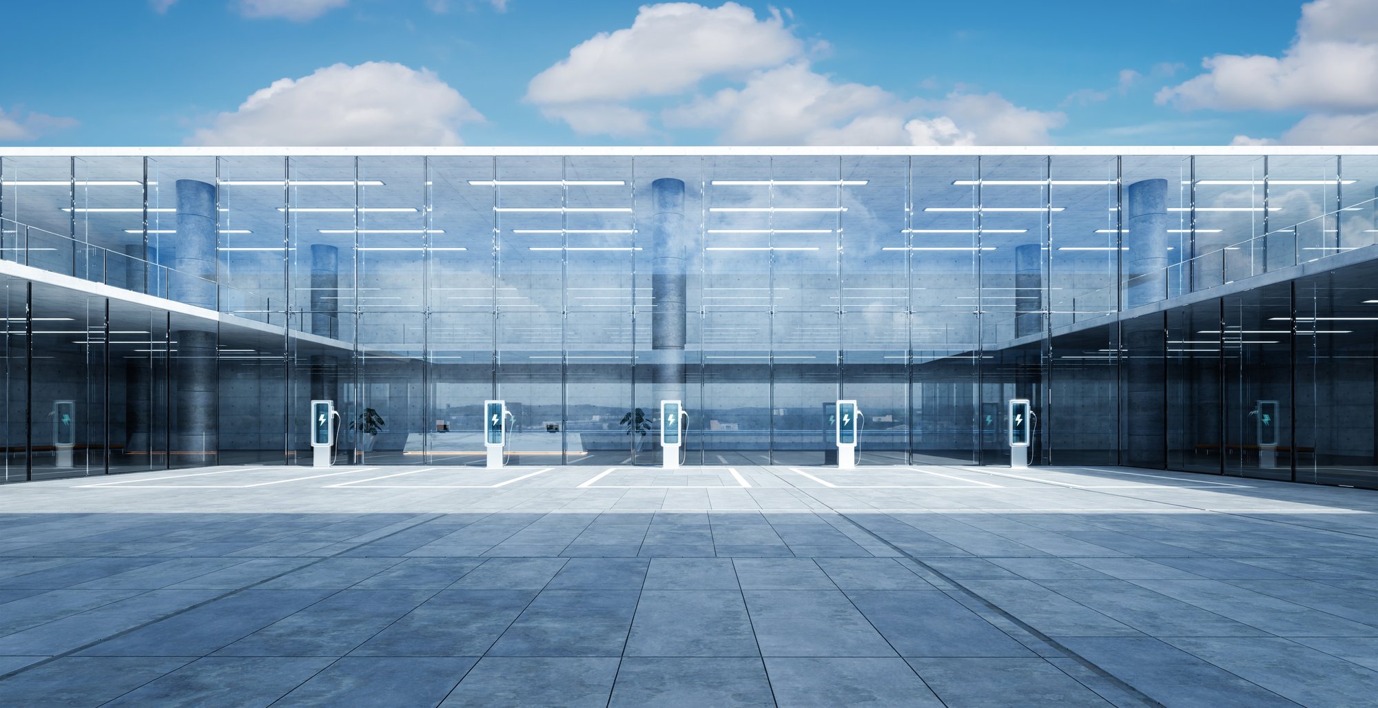 row of fleet EV charging stations in company parking lot